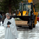 Illustration for article titled Digger Carried To Grave In His Backhoe